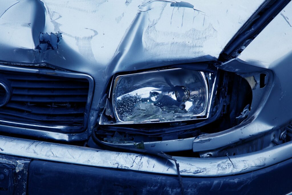 A crumpled headlight illustrates the increase in car accidents since the pandemic began